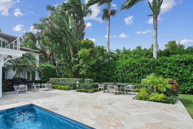 315 E Rivo Alto Dr, Miami Beach, FL 33139 - outdoor pool featuring a patio and outdoor dining space
