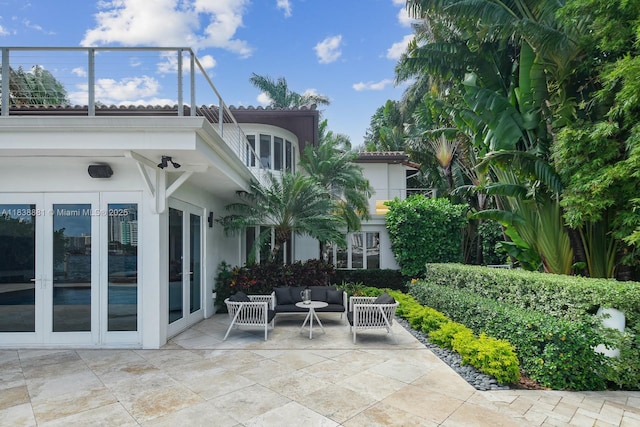 315 E Rivo Alto Dr, Miami Beach, FL 33139 - view of patio / terrace featuring french doors and an outdoor living space