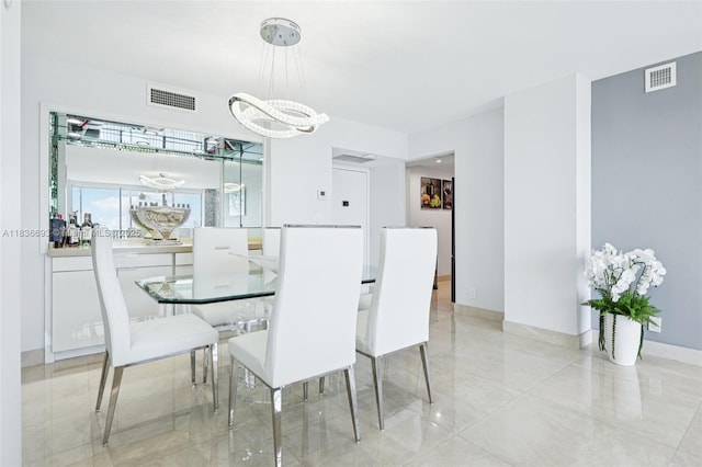 20379 W Country Club Dr Unit 1436, Aventura, FL 33180 - dining space featuring a chandelier and baseboards