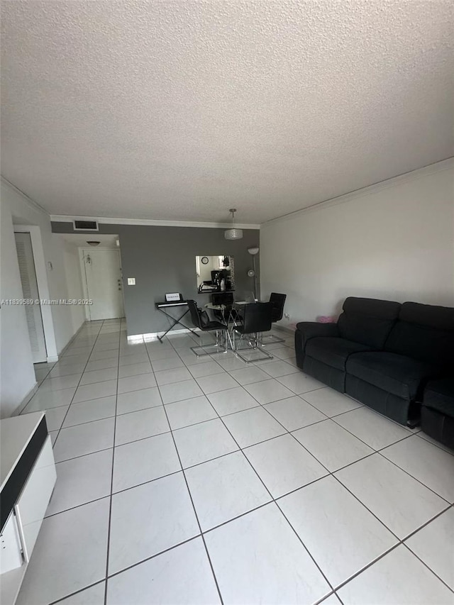 17000 NW 67th Ave Unit 206, Hialeah, FL 33015 - living area featuring a textured ceiling, light tile patterned floors, and crown molding