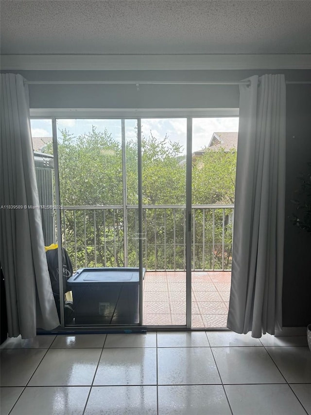17000 NW 67th Ave Unit 206, Hialeah, FL 33015 - doorway featuring healthy amount of natural light, tile patterned flooring, and a textured ceiling