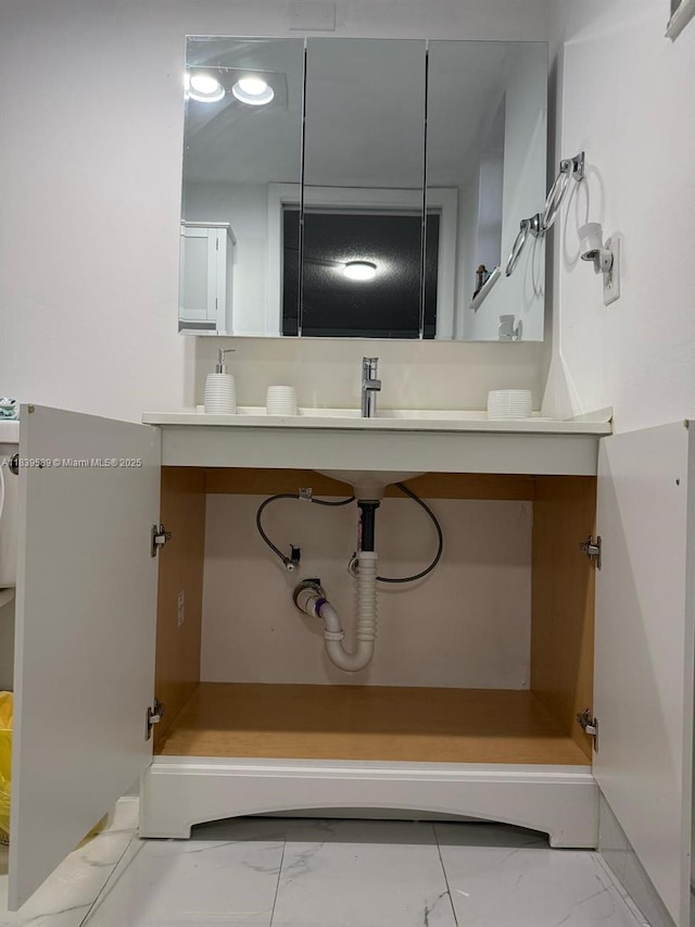 17000 NW 67th Ave Unit 206, Hialeah, FL 33015 - bathroom featuring marble look tile flooring and vanity