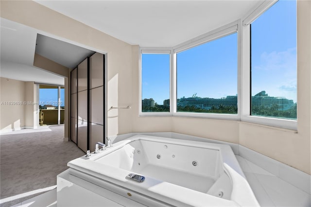 300 S Pointe Dr Unit 501, Miami Beach, FL 33139 - bathroom featuring healthy amount of natural light and a whirlpool tub