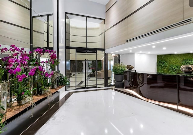 300 S Pointe Dr Unit 501, Miami Beach, FL 33139 - lobby with a high ceiling and recessed lighting