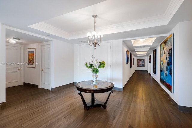 445 Grand Bay Dr Unit 1011, Key Biscayne, FL 33149 - hall with a raised ceiling, dark wood finished floors, a chandelier, and crown molding