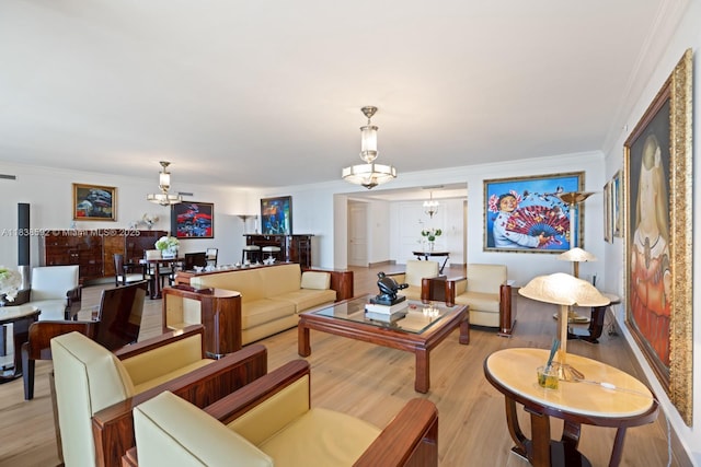 445 Grand Bay Dr Unit 1011, Key Biscayne, FL 33149 - living room featuring a chandelier, ornamental molding, and light wood-style flooring