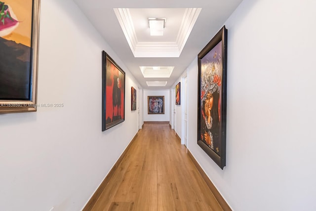 445 Grand Bay Dr Unit 1011, Key Biscayne, FL 33149 - hallway with a tray ceiling, light wood-style floors, and crown molding