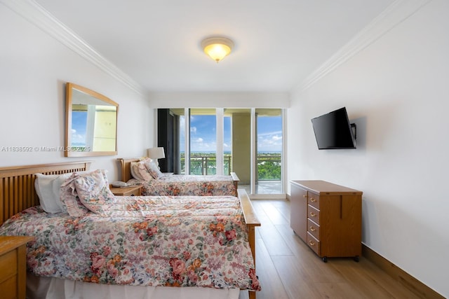 445 Grand Bay Dr Unit 1011, Key Biscayne, FL 33149 - bedroom featuring crown molding, light wood-style floors, and access to exterior