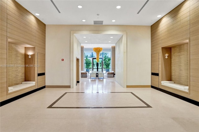 445 Grand Bay Dr Unit 1011, Key Biscayne, FL 33149 - building lobby featuring recessed lighting and wood walls