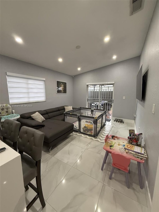 3134 W 70th Ter, Hialeah, FL 33018 - living room featuring light marble finish flooring and recessed lighting