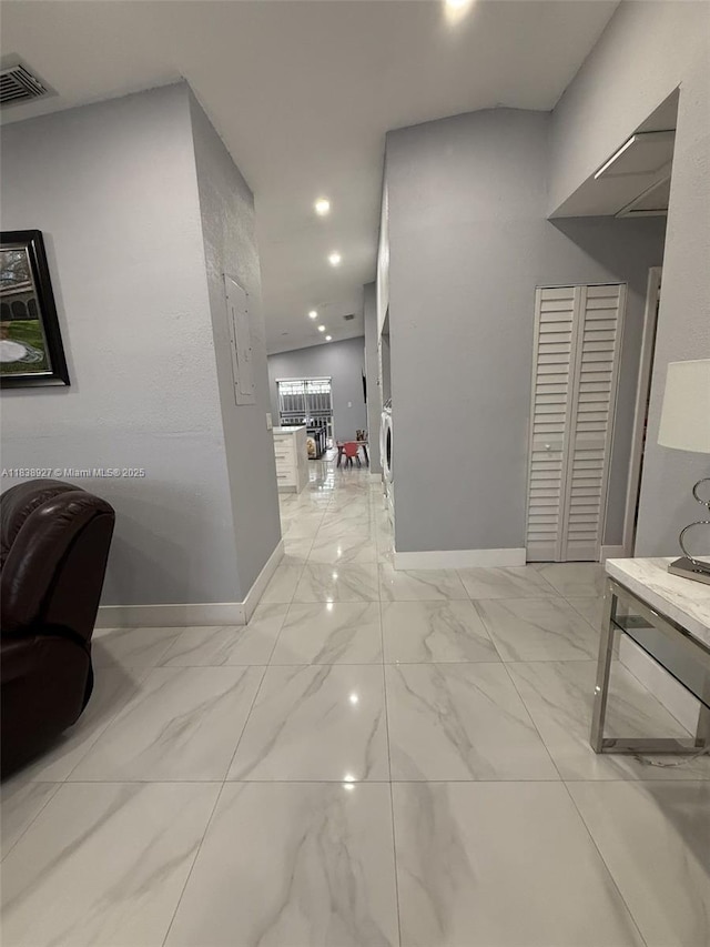 3134 W 70th Ter, Hialeah, FL 33018 - hallway with recessed lighting, light marble finish floors, and washer / clothes dryer