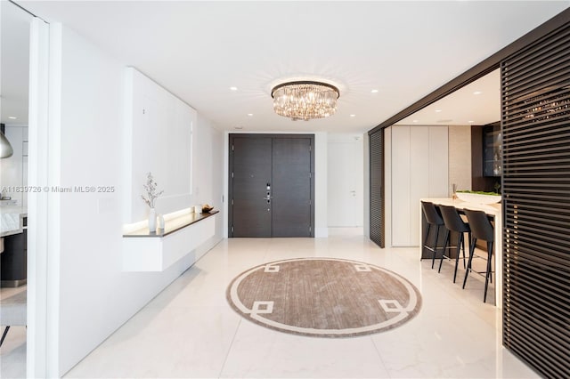 17475 Collins Ave Unit 1001, Sunny Isles Beach, FL 33160 - tiled entrance foyer with recessed lighting and a chandelier