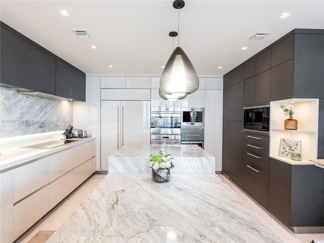 17475 Collins Ave Unit 1001, Sunny Isles Beach, FL 33160 - kitchen featuring modern cabinets, built in appliances, tasteful backsplash, decorative light fixtures, and recessed lighting