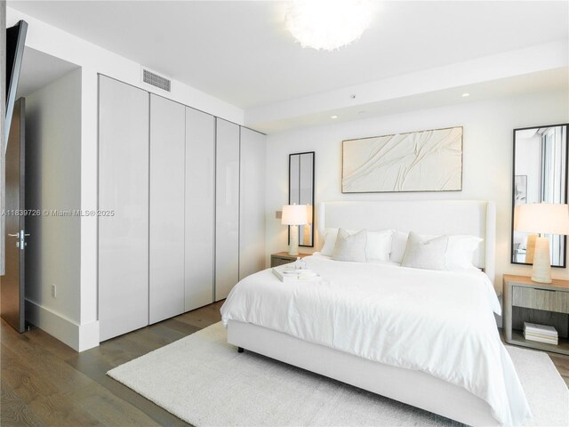17475 Collins Ave Unit 1001, Sunny Isles Beach, FL 33160 - bedroom with wood finished floors, a closet, and recessed lighting