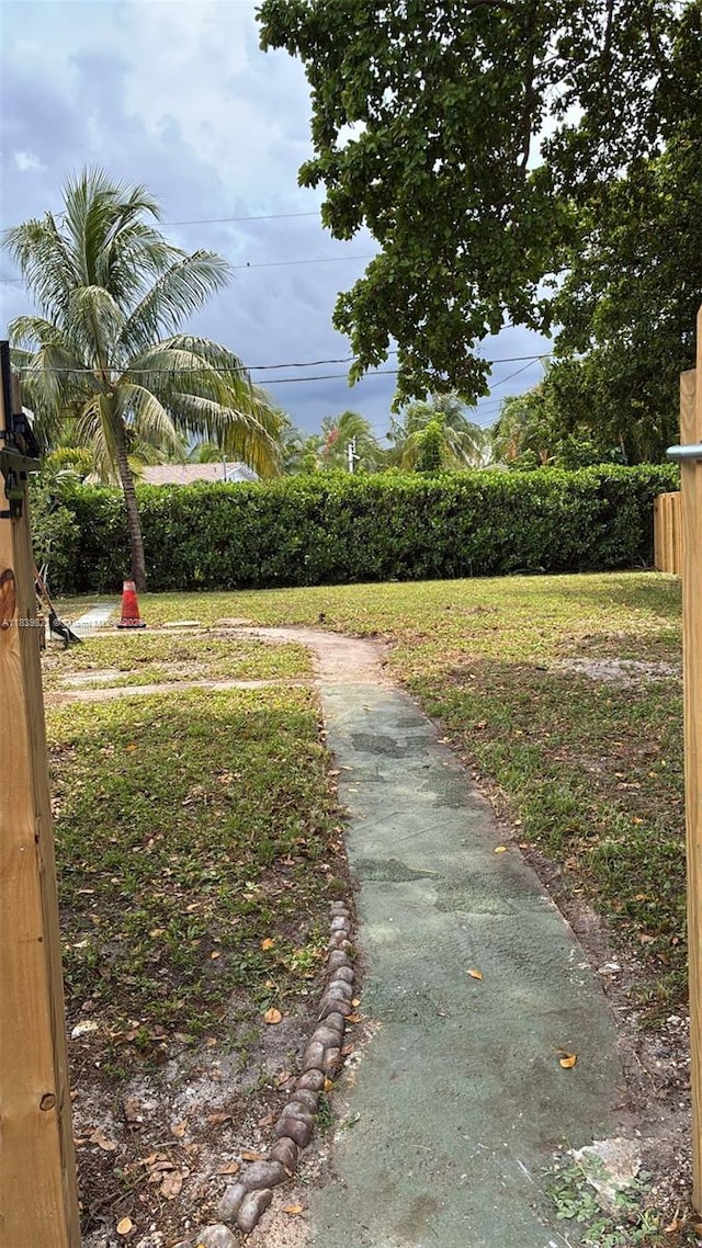 3851 NW 3rd Ter, Deerfield Beach, FL 33064 - view of home's community with a lawn