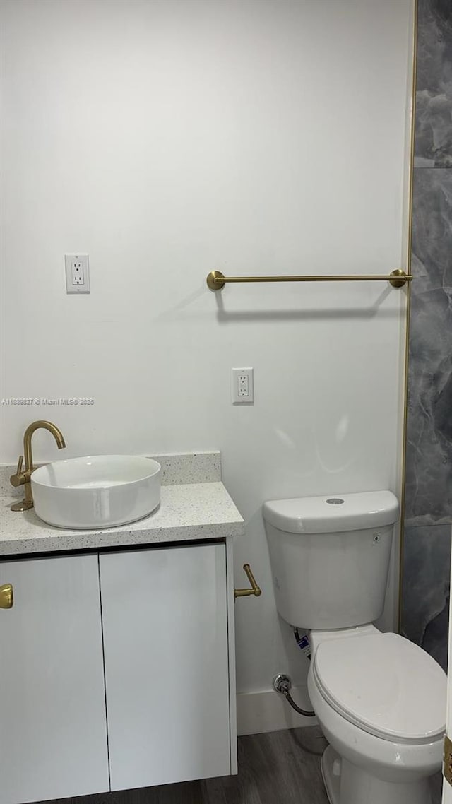 3851 NW 3rd Ter, Deerfield Beach, FL 33064 - bathroom featuring vanity and wood finished floors