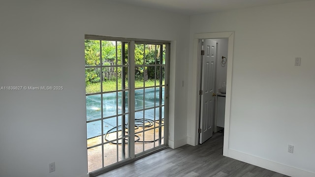 3851 NW 3rd Ter, Deerfield Beach, FL 33064 - unfurnished room featuring plenty of natural light and wood finished floors