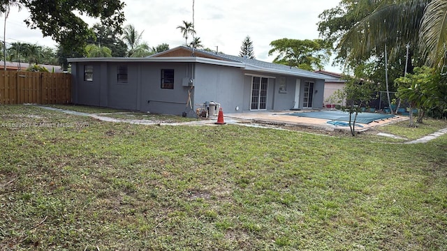 3851 NW 3rd Ter, Deerfield Beach, FL 33064 - back of house featuring a patio area and a covered pool