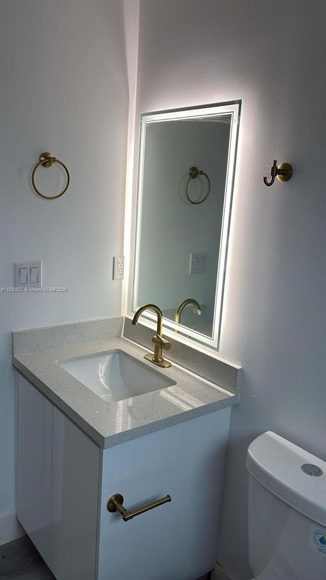 3851 NW 3rd Ter, Deerfield Beach, FL 33064 - half bathroom featuring vanity and toilet