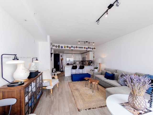 999 SW 1st Ave Unit 1609, Miami, FL 33130 - living area featuring track lighting and light wood-style floors