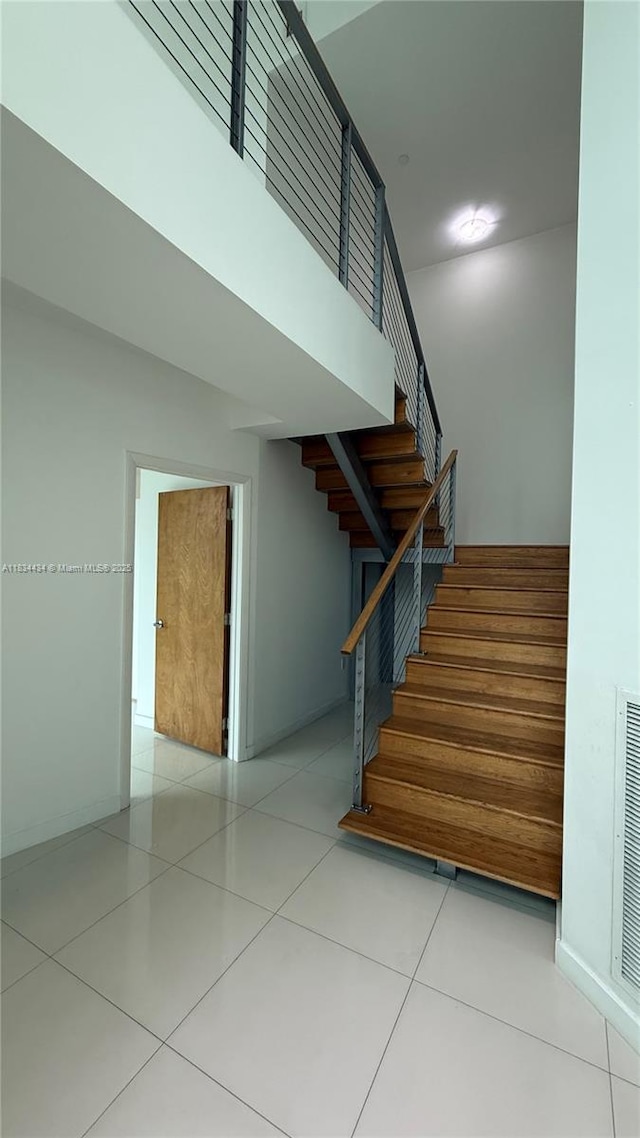 350 S Miami Ave Unit 312, Miami, FL 33130 - stairway with a towering ceiling and tile patterned floors
