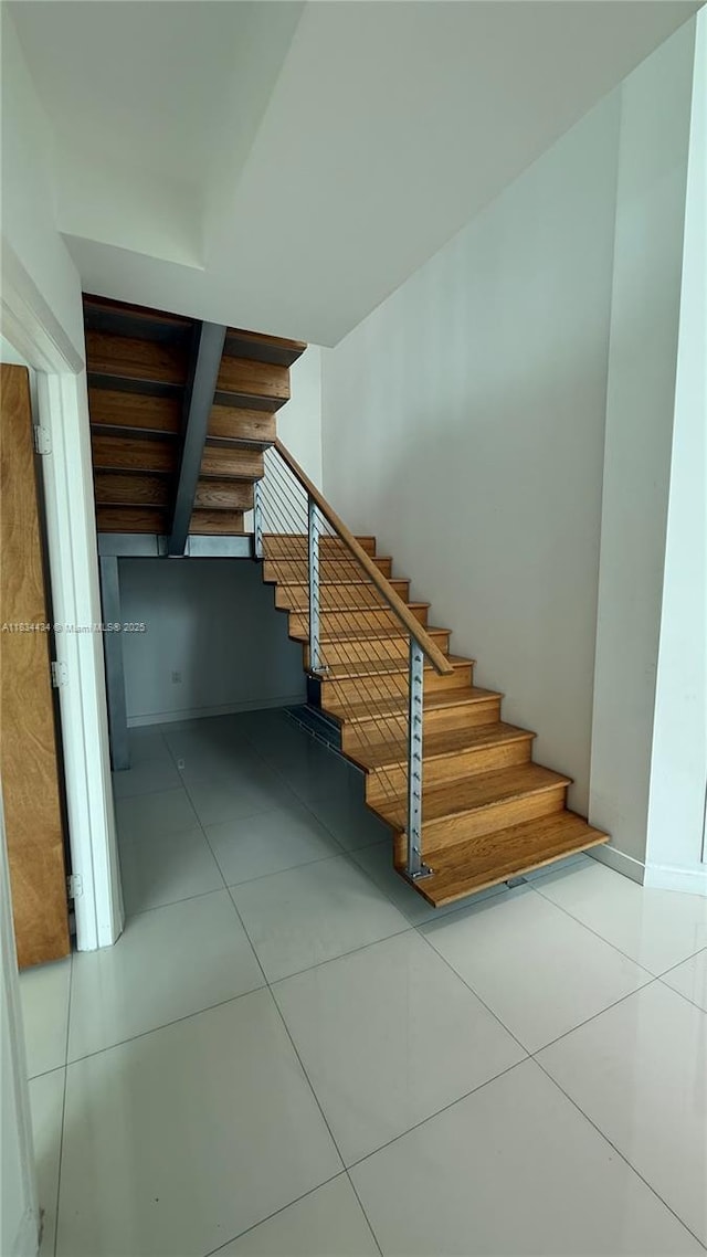 350 S Miami Ave Unit 312, Miami, FL 33130 - stairway featuring tile patterned floors and baseboards