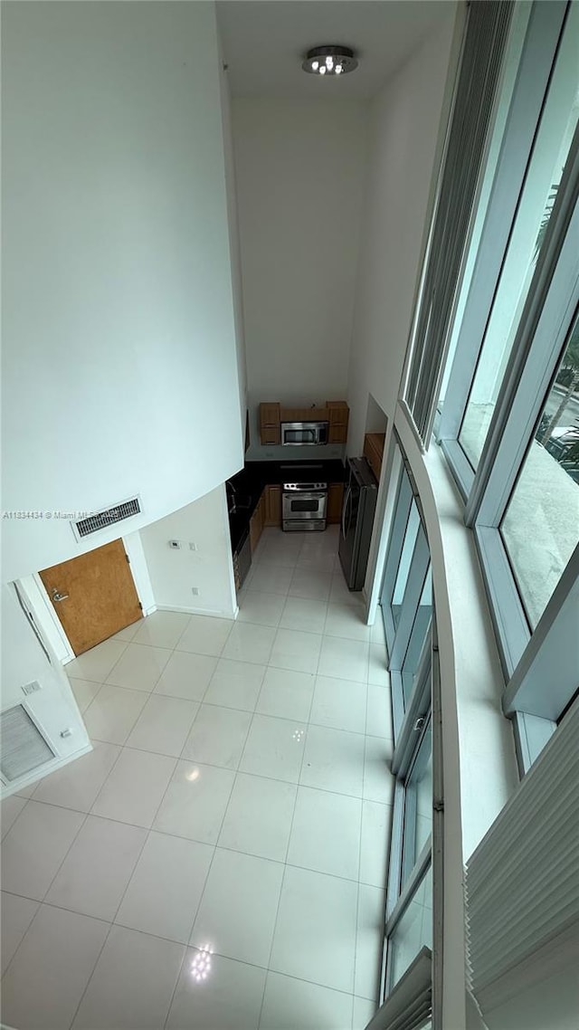 350 S Miami Ave Unit 312, Miami, FL 33130 - unfurnished room with light tile patterned flooring
