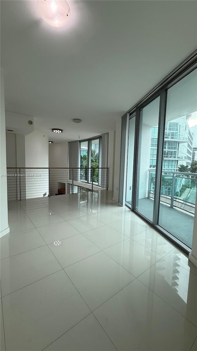 350 S Miami Ave Unit 312, Miami, FL 33130 - tiled empty room featuring floor to ceiling windows