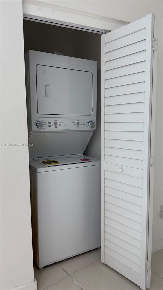 350 S Miami Ave Unit 312, Miami, FL 33130 - laundry room with stacked washer and clothes dryer and light tile patterned floors