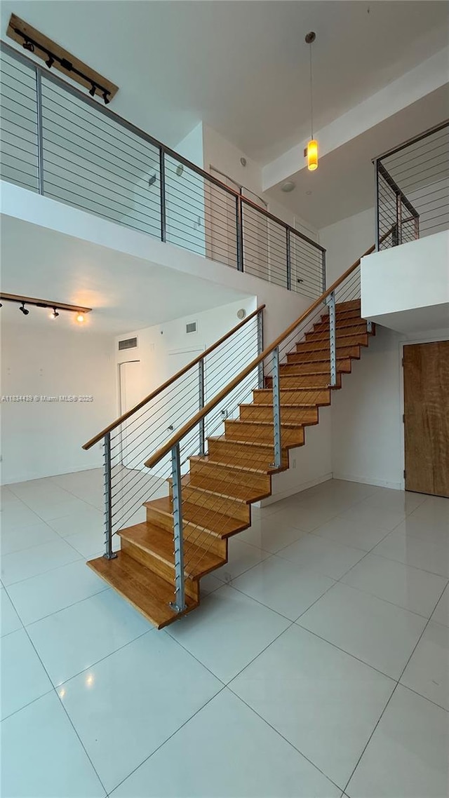 350 S Miami Ave Unit 302, Miami, FL 33130 - stairs with a high ceiling and tile patterned flooring