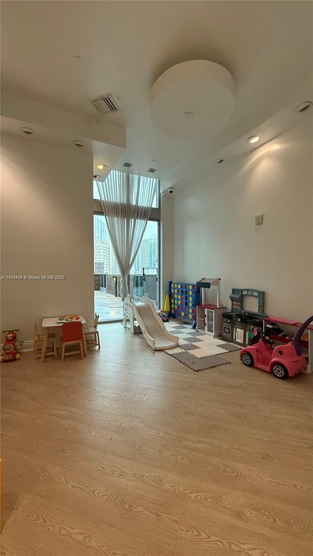 350 S Miami Ave Unit 302, Miami, FL 33130 - recreation room featuring wood finished floors and expansive windows