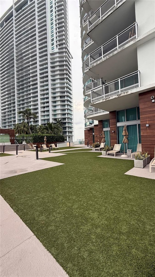350 S Miami Ave Unit 302, Miami, FL 33130 - surrounding community featuring a lawn