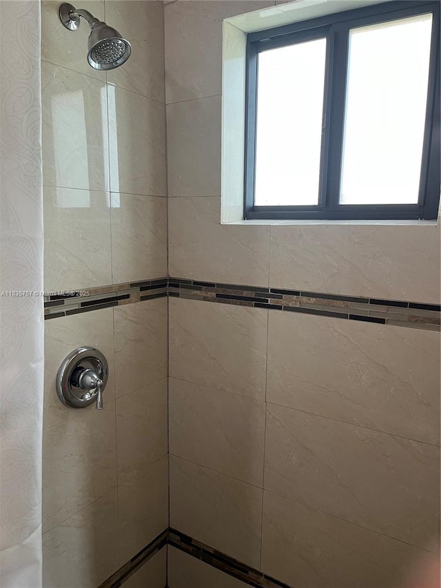 10851 SW 2nd St Unit K111, Sweetwater, FL 33174 - bathroom with a tile shower and plenty of natural light