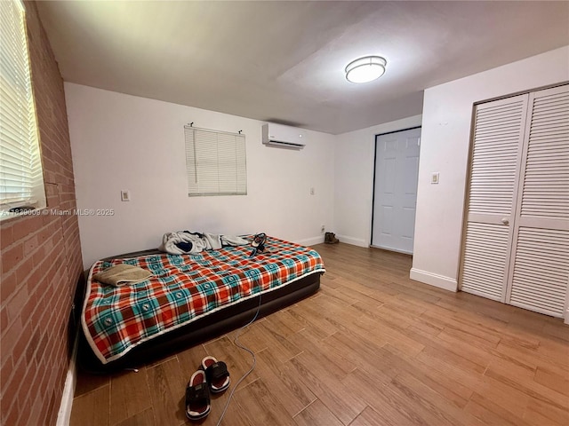2406 N 28th Ave, Hollywood, FL 33020 - bedroom with wood finished floors and a wall mounted AC