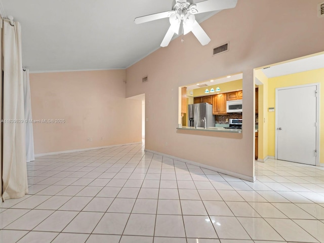 1440 Egret Rd, Homestead, FL 33035 - unfurnished living room featuring ceiling fan, high vaulted ceiling, light tile patterned floors, and crown molding