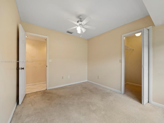1440 Egret Rd, Homestead, FL 33035 - unfurnished bedroom featuring carpet, a walk in closet, and ceiling fan