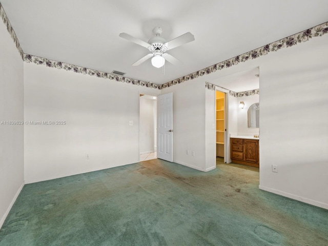 1440 Egret Rd, Homestead, FL 33035 - unfurnished bedroom featuring carpet flooring, connected bathroom, and ceiling fan