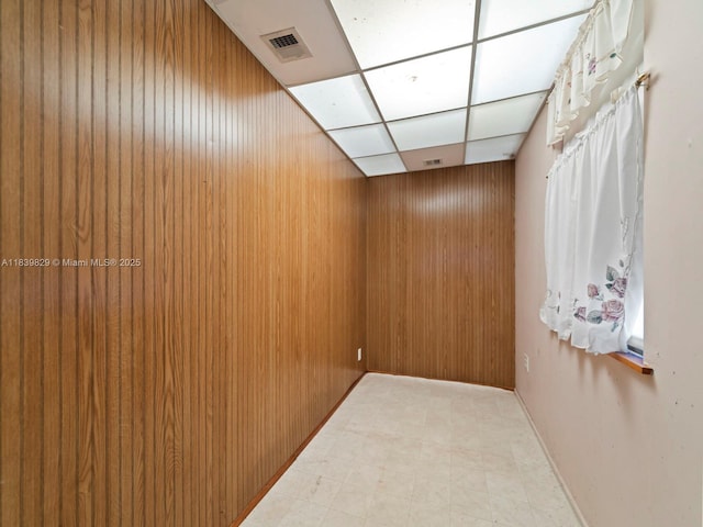 1440 Egret Rd, Homestead, FL 33035 - spare room with a paneled ceiling, light flooring, and wood walls