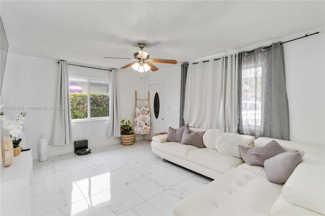 231 E 41st St, Hialeah, FL 33013 - living room with marble finish floors and a ceiling fan