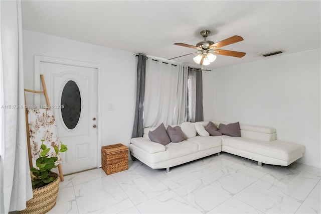 231 E 41st St, Hialeah, FL 33013 - living area with ceiling fan and marble finish flooring