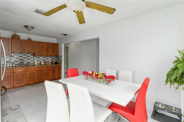 231 E 41st St, Hialeah, FL 33013 - dining room with light marble finish flooring and ceiling fan