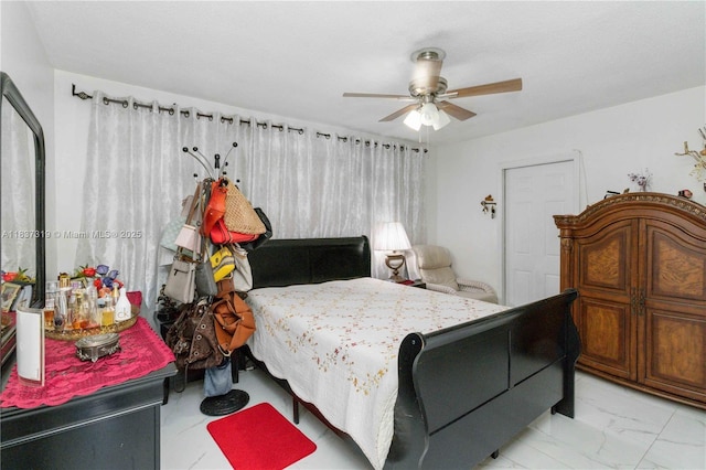 231 E 41st St, Hialeah, FL 33013 - bedroom featuring light marble finish flooring and a ceiling fan