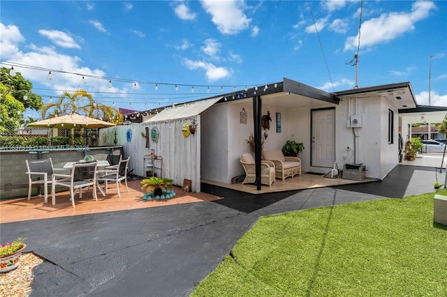 231 E 41st St, Hialeah, FL 33013 - view of front facade with a patio and stucco siding