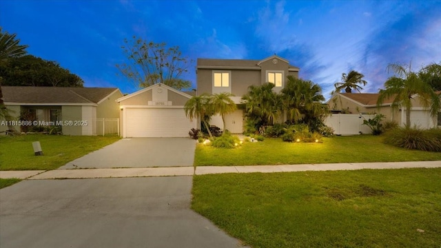 18701 Shauna Manor Dr, Boca Raton, FL 33496 - view of front facade featuring driveway, a garage, and stucco siding