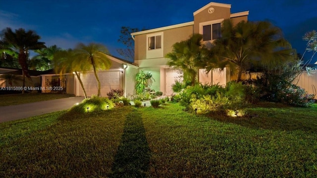 18701 Shauna Manor Dr, Boca Raton, FL 33496 - view of front of house with stucco siding, concrete driveway, and a yard
