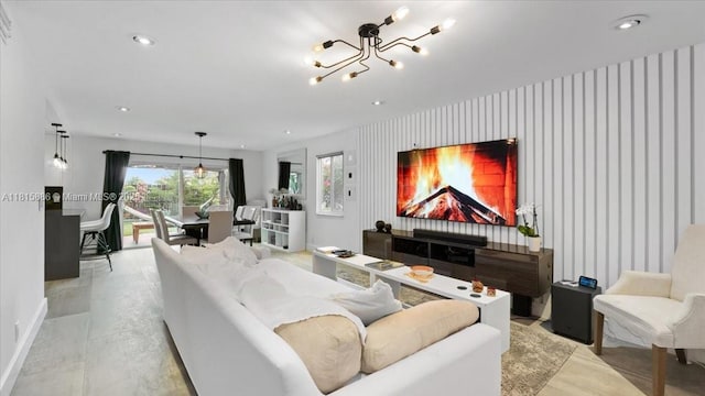 18701 Shauna Manor Dr, Boca Raton, FL 33496 - living area featuring an accent wall, a chandelier, wallpapered walls, finished concrete flooring, and recessed lighting