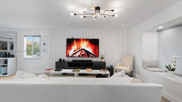 18701 Shauna Manor Dr, Boca Raton, FL 33496 - living room featuring a chandelier, an accent wall, and recessed lighting