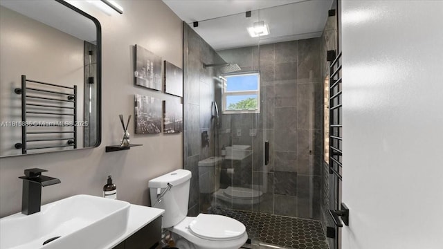 18701 Shauna Manor Dr, Boca Raton, FL 33496 - bathroom with a towel warming rack, a shower stall, vanity, and radiator heating unit