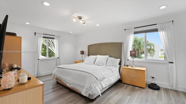 18701 Shauna Manor Dr, Boca Raton, FL 33496 - bedroom with recessed lighting and light wood-style flooring