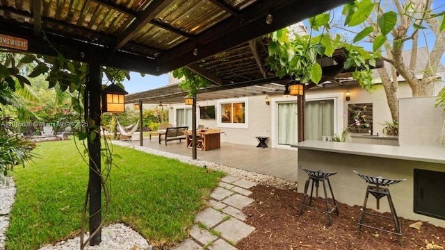 18701 Shauna Manor Dr, Boca Raton, FL 33496 - back of house featuring a yard, a patio area, and stucco siding